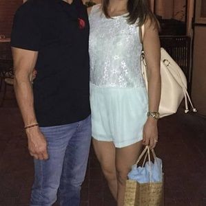 Lace sleeveless pleated romper.